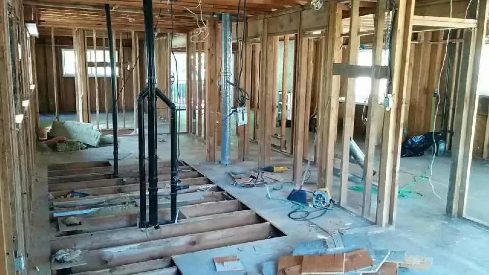 Back to the bones renovation · Floorplan reconfiguration and full plumbing, mechanical, and electrical upgrade
