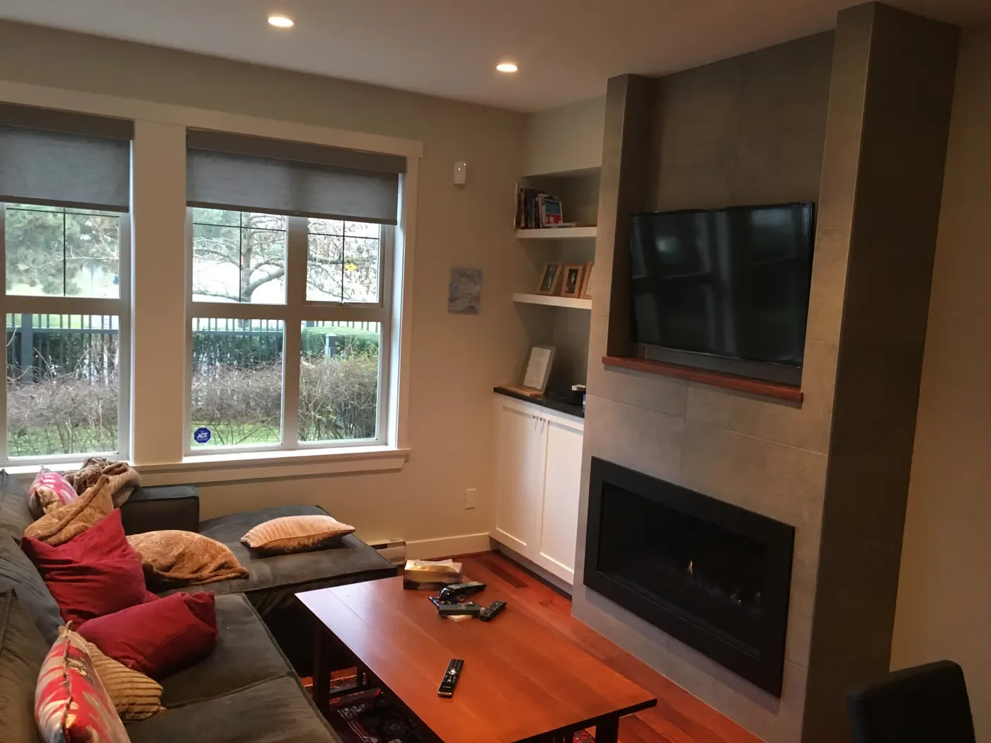 Update to linear fireplace with cabinets and tile facade