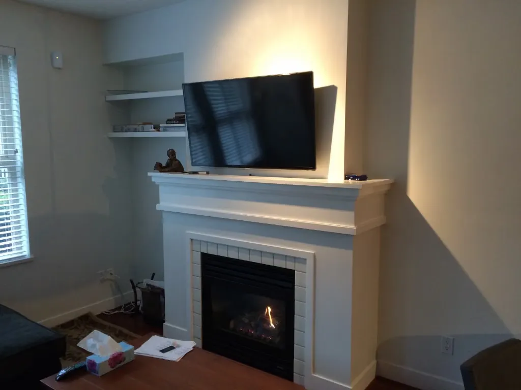 The original dated fireplace before renovation